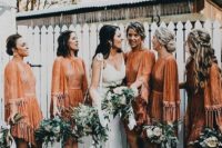 10 rust mini dresses with long fringed sleeves, high necklines and asymmetrical skirts for a boho wedding