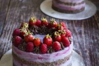 13 a berry ombre vegan wedding cake with a chocolate brownie layer topped with fresh strawberries