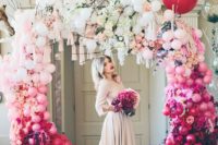 13 a bold ombre balloon, bloom and tassel wedding arch will make a gorgeous trendy statement in your ceremony space