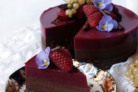 14 a chocolate raspberry Bavarian cake that is gluten-free and gluten-free with berries and flowers on top and raspberry agar jelly