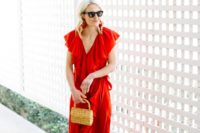14 a red wrap ruffled maxi dress with cap sleeves, a small wicker bag and embellished sandals