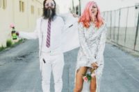 14 the couple wearing crazy outfits and white sneakers both to accent their cool looks even more