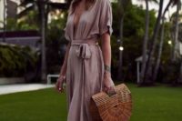 15 a blush maxi dress with short sleeves, a plunging neckline and a sash, a wooden bag and nude heels