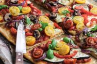 15 vegan pizza with various tomatoes, eggplants, peppers looks bright and bold