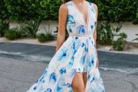 16 a bright blue floral print jumpsuit with a long skirt over it, a V-neckline and no sleeves plus nude heeled sandals