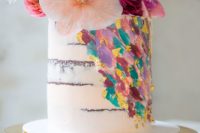 17 a fantastic handpainted wedding cake with colorful brushstrokes and bold fresh blooms on top