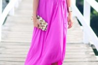 17 a hot pink maxi dress with an asymmetrical skirt and a halter neckline, a metallic bracelet and shoes