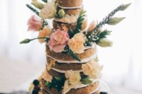 17 a naked vegan gluten-free wedding cake topped with fresh berries, blooms and some greenery