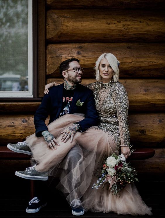 an off the grid bridal look with a blush heavily embellished wedding gown and grey sneakers