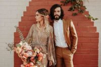 20 a rust-colored suit, black shoes and a white shirt is a chic outfit for a boho chic wedding