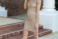 20 a sheath gold sequin over the knee dress with short sleeves, dusty pink heels and a neutral clutch