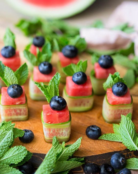 juicy watermelon cucumber vegan appetizers with mint and blueberries on top for a summer wedding