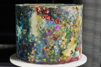 21 a moody handpainted wedding cake with lots of small blooms looks like a real masterpiece