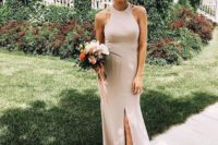 21 a neutral halter necklien maxi bridesmaid dress with a front slit features two trends in one
