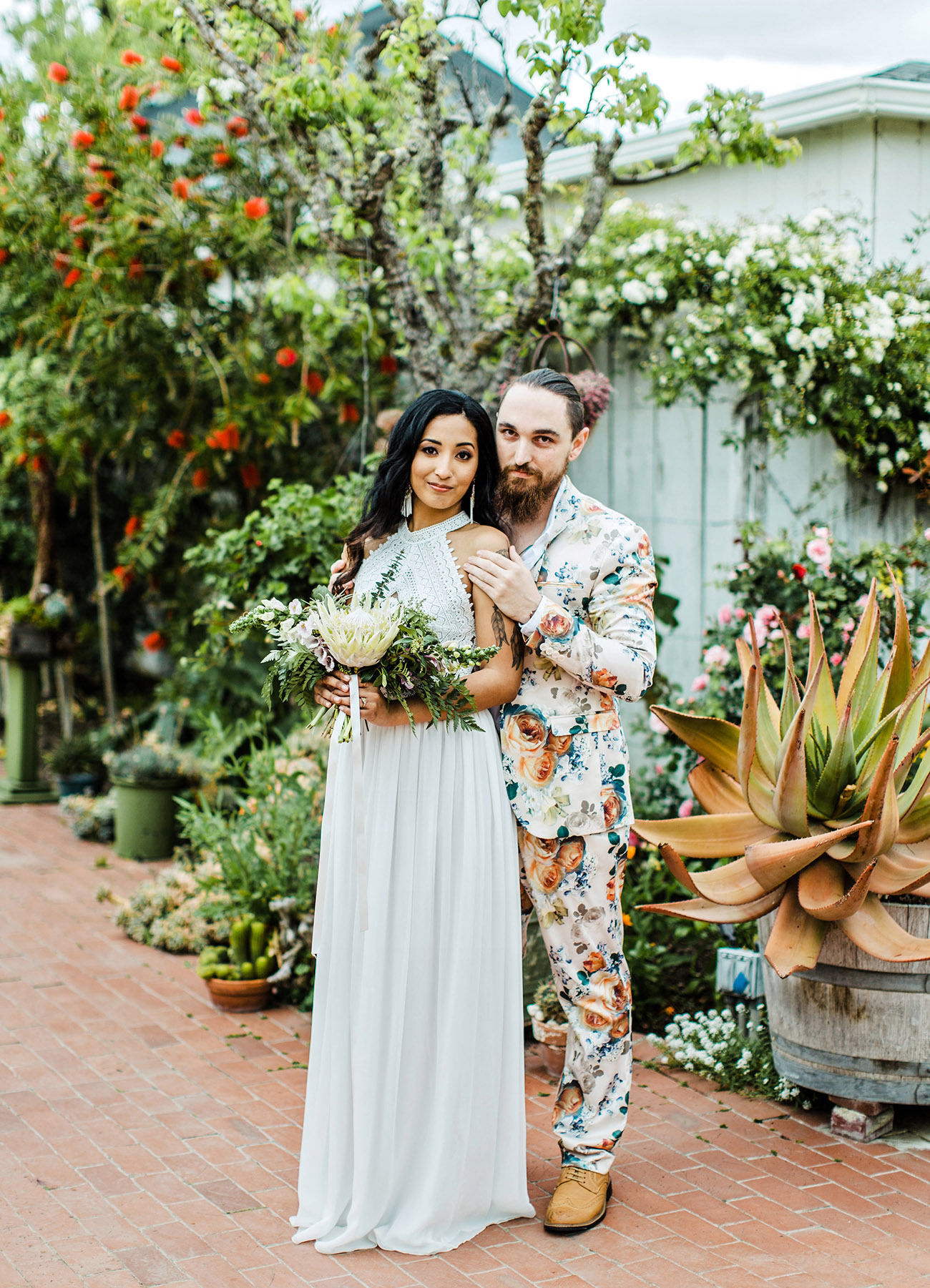 a super colorful florla suit with a white shirt and no tie, amber shoes for a colorful tropical wedding