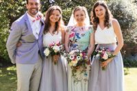 22 bridesmaids wearing lilac skirts and white tops, a bridesman wearing grey pants and a lilac blazer to match