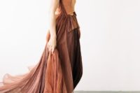 23 a gorgeous rust-colored wedding dress with a sculptural neckline and a layered skirt