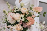 23 a tender wedding bouquet of pink anthuriums and blush roses plus lots of textural greenery