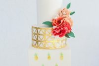 24 a creative wedding cake with handpainted pineapples, a metallic tier and a pure white one plus some sugar flowers