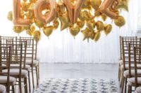24 a gold balloon wedding backdrop of LOVE letters and hearts and stars for a modern fun look