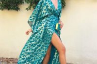 24 a kimono-styled turquoise and gold maxi dress with a high slit, a V-neckline and metallic shoes
