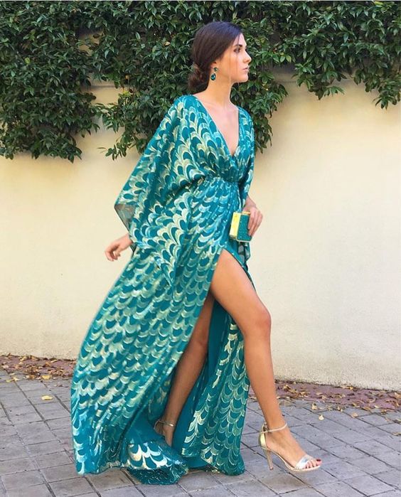 a kimono styled turquoise and gold maxi dress with a high slit, a V neckline and metallic shoes