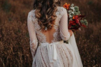 24 a whimsy polka dot wedding dress with long sleeves, a cutout lace back and a train looks very boho romantic-like