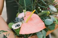 25 a catchy bridesmaid wedding bouquet of various greenery, thistles, anemones and a pink anthurium