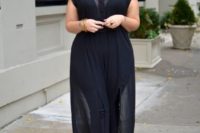 25 a chic look with a black strapless jusmpsuit, a sheer black overgown with buttons and white shoes