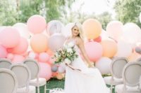 25 a soothing pastel balloon wedding backdrop in pink, peachy, soft orange and grey for a cool look