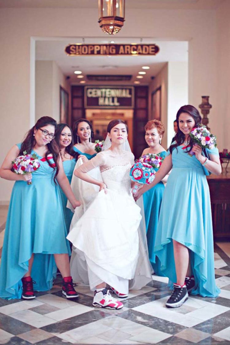 this sporty bride preferred colorful trainers for her wedding day and all the bridesmaids were wearing trainers, too