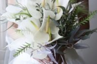 26 a beautiful wedding bouquet of various foliage and large white anthuriums