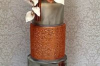26 a stunning wedding cake with grey marble tiers, sugar blooms and touches of rust for a glam wedding