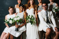 26 a white bridal party with a bridesman wearing a creamy suit with shorts, a grey tie and grey shoes