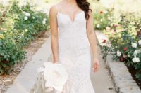 27  a sexy white lace sheath wedding dress with spaghetti straps and a plunging neckline