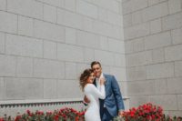 33 a lace sheath wedding dress with long sleeves and a semi-cathedral train