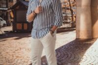 a beach wedding guest look with a striped navy and white shirt, white pants, black sandals is a cool idea for a relaxed beach wedding