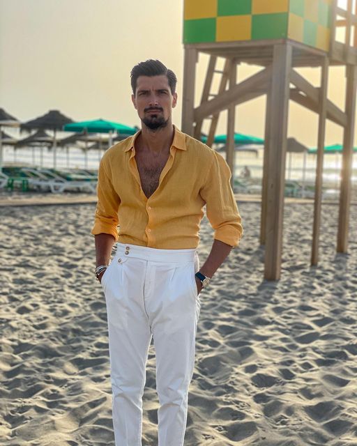 a bold beach summer wedding guest look with a yellow linen shirt, white trousers is a cool idea if you want some color