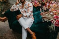a bold floral shirt, white pants, amber shoes for a fun and bright beach or tropical wedding guest look