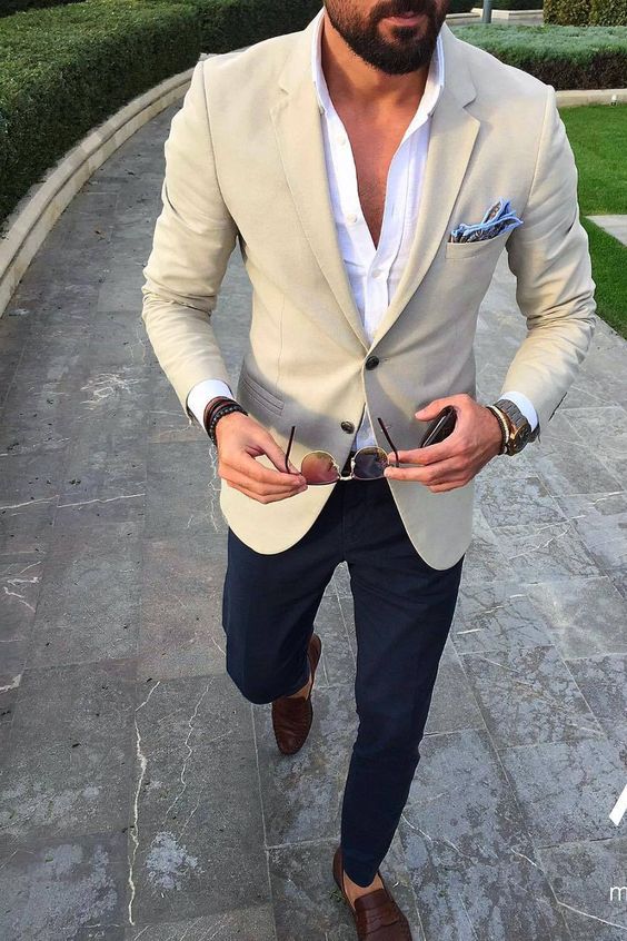 a classic yet modern look with navy pants, a white shirt, a creamy blazer and brown moccasins