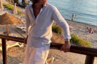 a pale blue linen shirt, white linen pants, grey loafers are a great and easy combo for a relaxed beach wedding