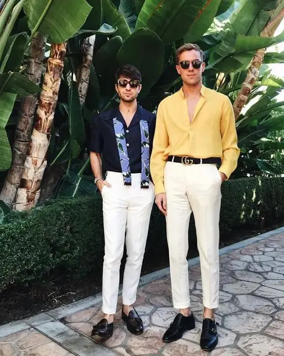 bold summer men wedding guest looks with white pants, a navy and a yellow shirt, black loafers and belts