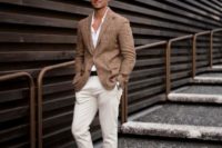 creamy cropped pants, a white shirt, a tan blazer and brown moccasins plus sunglasses for a beach wedding