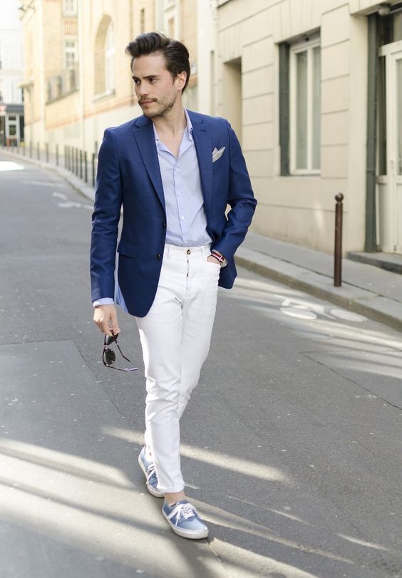 white jeans, a light blue shirt, a blue blazer and blue sneakers for a touch of casual