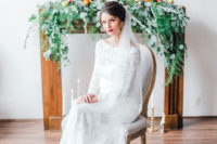 02 The bride was rocking a bateau neckline lace wedding dress with long sleeves, a plum lip and a wavy updo with a long veil