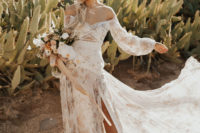 02 The bride was wearing a fantastic off the shoulder floral wedding dress with a side slit, long sleeves and intricate lace