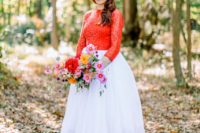 02 a bright bridal look with a red lace top with long sleeves and matching  shoes plus a tulle white skirt
