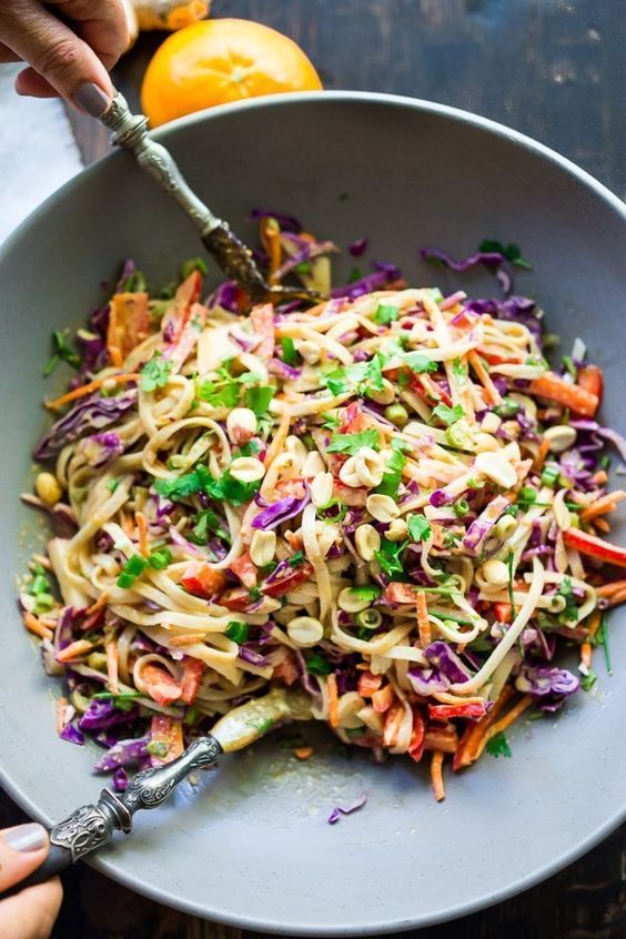 thai noodle salad with peanut sauce, a mix of cabbage, red bell pepper and cilantro is very refreshing
