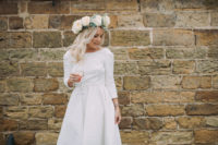 03 a textural high low wedding dress with long sleeves and a train plus gold mules that add a shiny touch