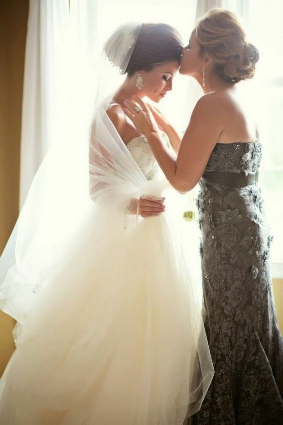 mother blessing her daughter before the wedding ceremony - this is a gorgeous shot to take in the morning